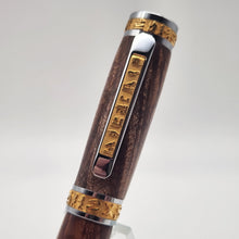 Load image into Gallery viewer, Chrome and gold Pharaoh rollerball in stabilized curly maple