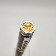 Load image into Gallery viewer, Chrome and gold Pharaoh rollerball in stabilized curly maple
