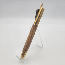 Load image into Gallery viewer, Brass and oil rubbed bronze piston pen in Bethlehem Olive wood
