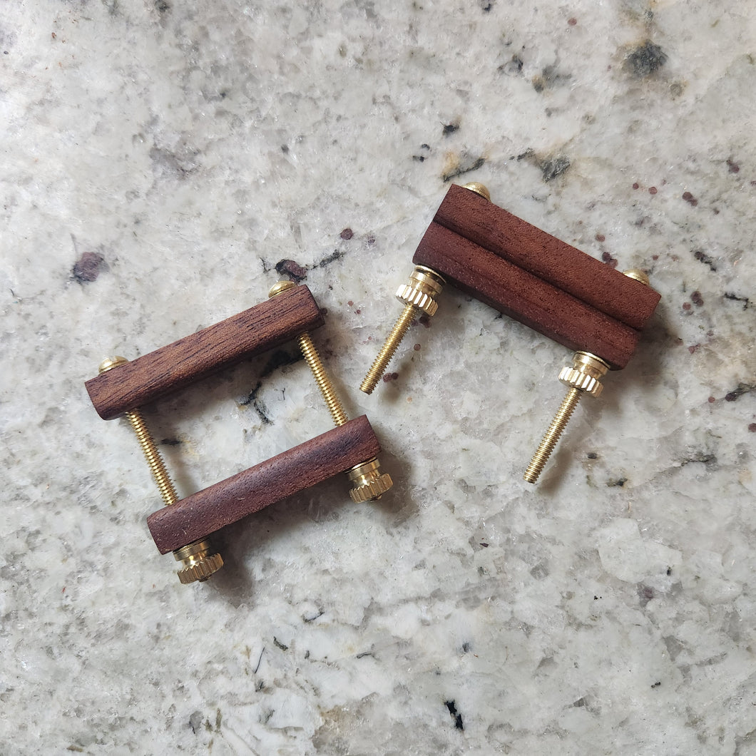 Nipple clamps in African mahogany.